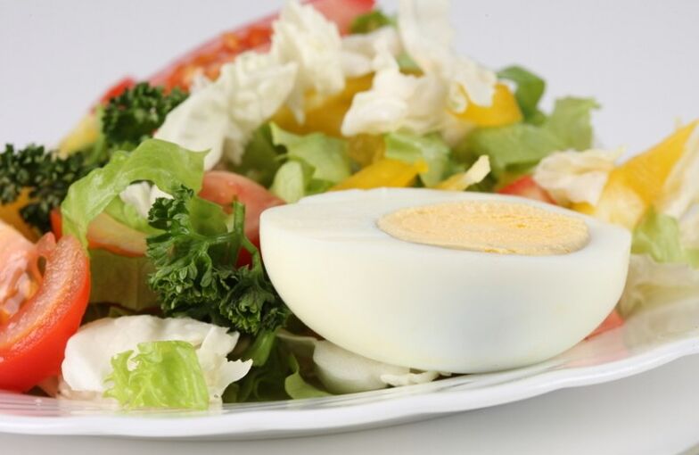 Fresh vegetable salad with boiled egg on Maggi's diet menu